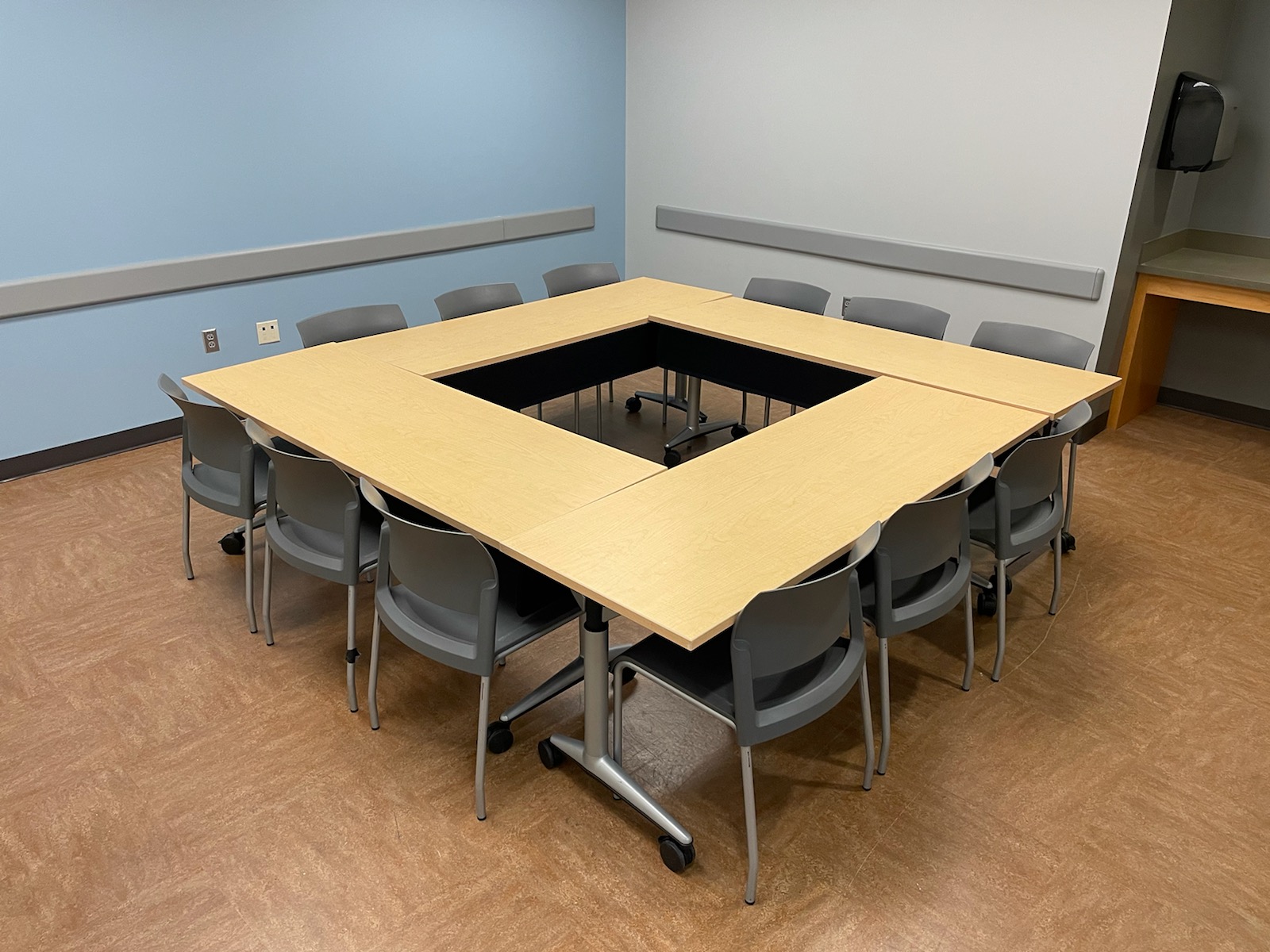 Photo of Conference style table setup for capacity of 12