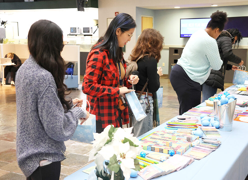 Photos of UNC students at the 2025 December Treat Yo Self event in the Carolina Union in the West Lounge Area.