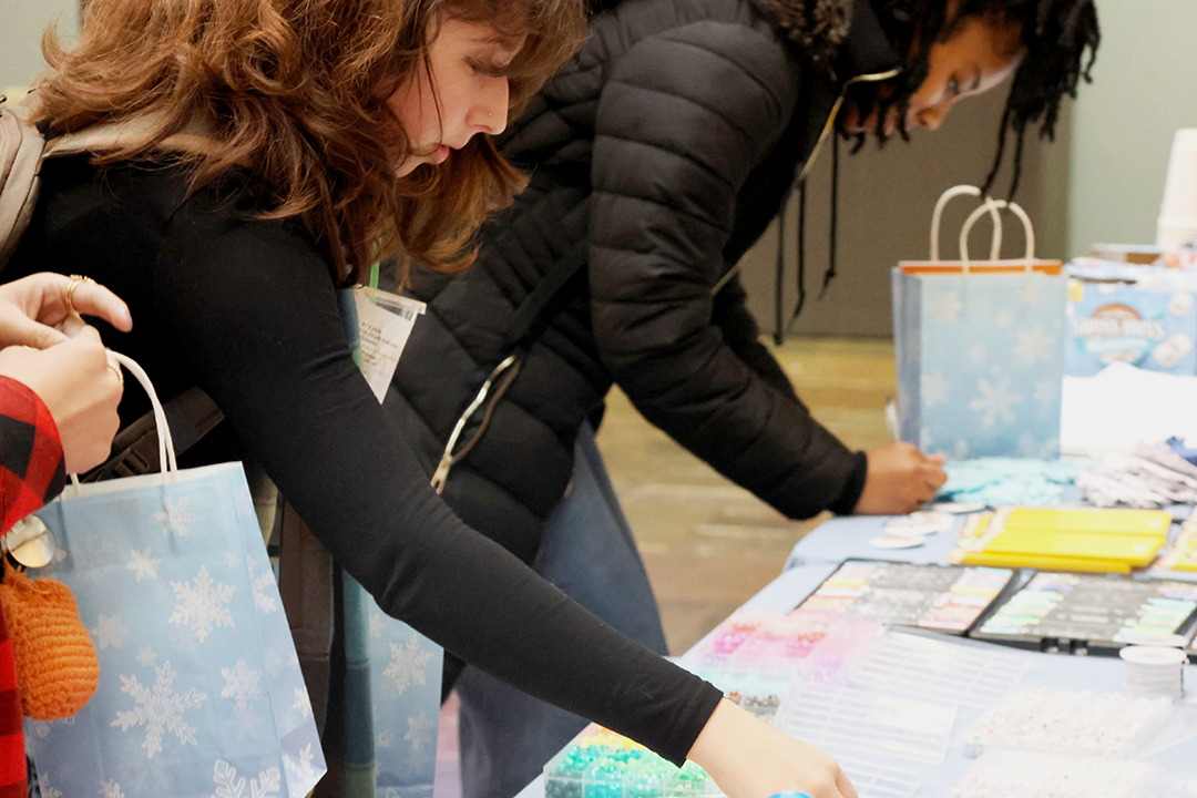 Photos of UNC students at the 2025 December Treat Yo Self event in the Carolina Union in the West Lounge Area.