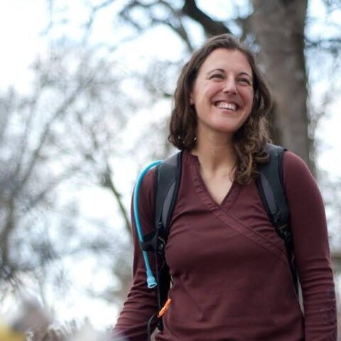 A person with a backpack in the woods