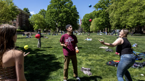 Students juggling on the quad of a University